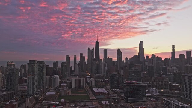 Chicago Skyline Under Dramatic Pink and Orange Sunset Clouds