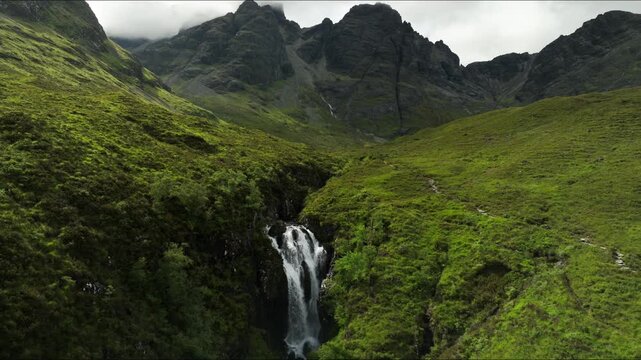 Mountain river and waterfall along scenic road in the Isle of Skye, Scotland