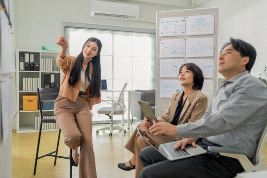 Diverse business team celebrating success with high five and applause during office presentation, brainstorming session with data analytics dashboard, teamwork and startup collaboration concept