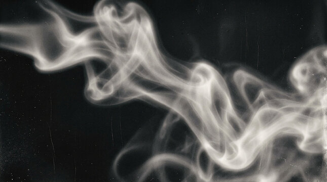 Abstract white smoke swirls on black background for artistic design overlays.