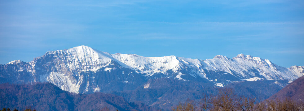 Mountains covered with snow. Beautiful wild nature of Alps