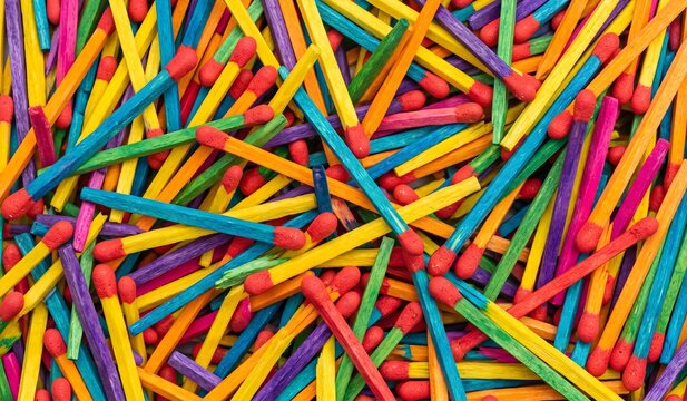 Vibrant Overhead Flat Lay Background Pattern of Scattered Multicolored Rainbow Matchsticks