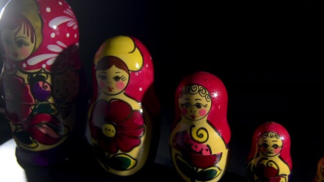 Row of traditional spinning Matryoshka Russian nesting dolls in descending size