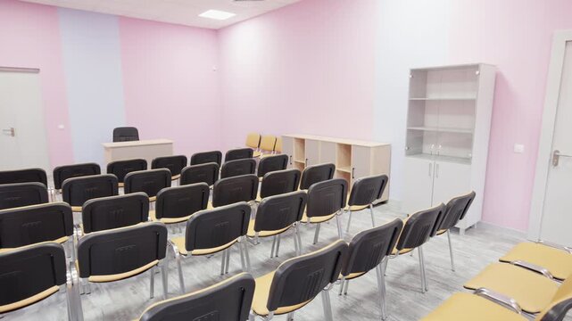 Conference room interior features modern seating and laminate flooring. Clean organized layout provides welcoming space for official events