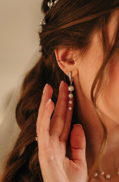 Close-Up of Elegant Pearl Bridal Earring on Bride