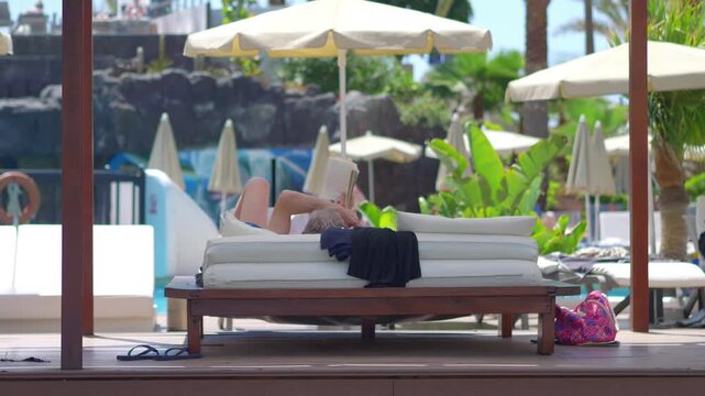 Reading a Book and Relaxing at a Tropical Beach Resort in 4k slow motion 60fps
