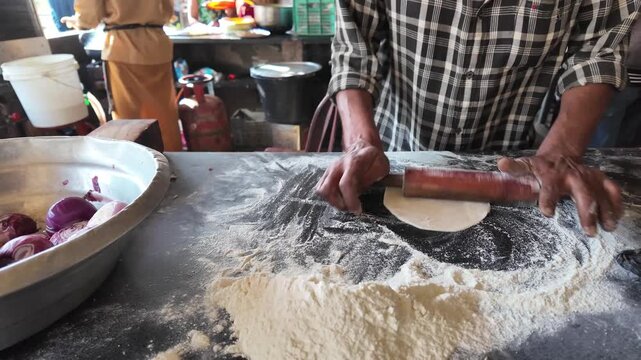 Indian Street Vendor Cooking Puffy Flatbread And Serving Traditional Chickpea Curry