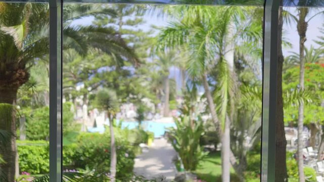 Beautiful and inviting tropical resort offering serene beach views, lush vegetation, and luxurious amenities in 4k slow motion 60fps