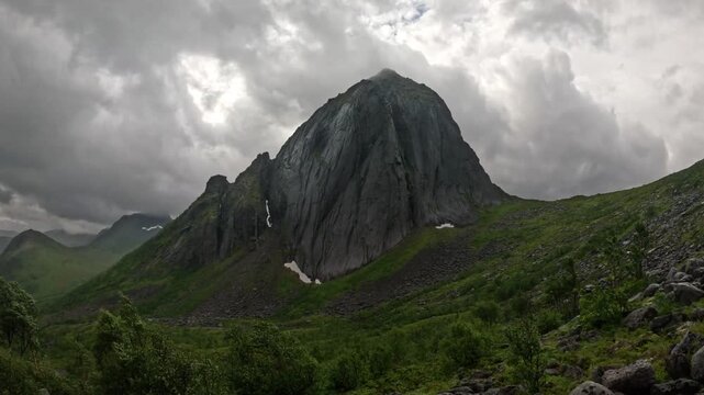 Static wide view of iconic Segla mountain peak with rocky slope foreground in Senja Norway