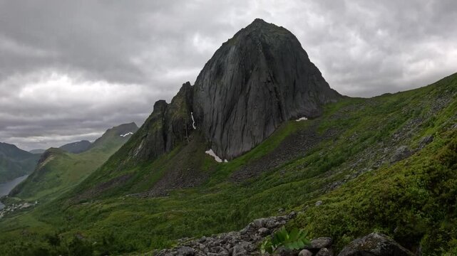 View of Segla mountain peak with rocky boulder foreground in Senja Norway