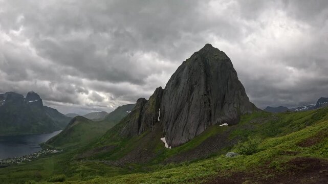 Ultra wide static shot of Segla mountain peak with fjord village view in Senja Norway