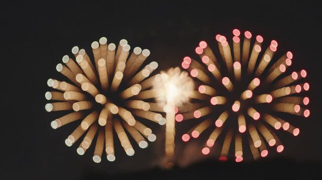 Beautiful bokeh fireworks exploding at night