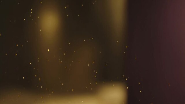 Golden dust particles floating in the air