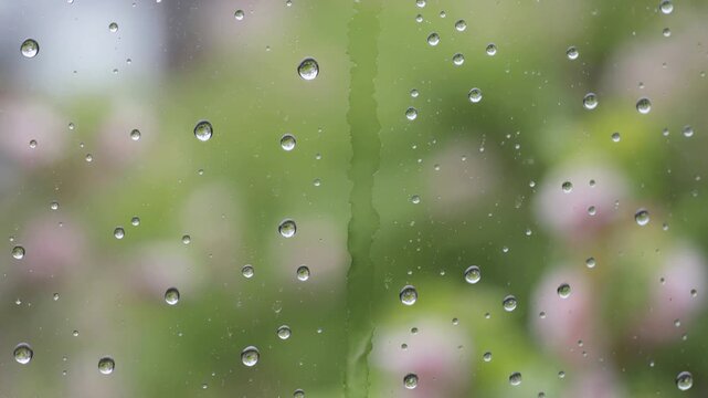 Raindrop sliding down a window pane