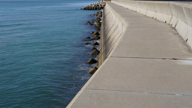 Concrete seawall protecting the coastline from ocean waves