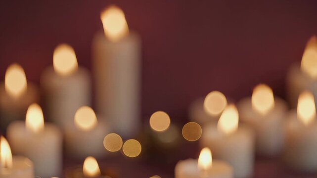 Romantic flickering bokeh candles burning in the dark
