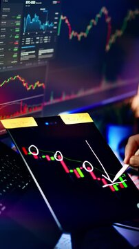 Crypto Market Crash Technical Analysis Bearish Trend Tablet Display. Close up view of trader analyzing cryptocurrency market drop drawing falling arrow and circles on digital tablet screen displaying 