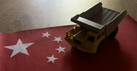 Naklejka premium truck stationary on a red flag with white stars