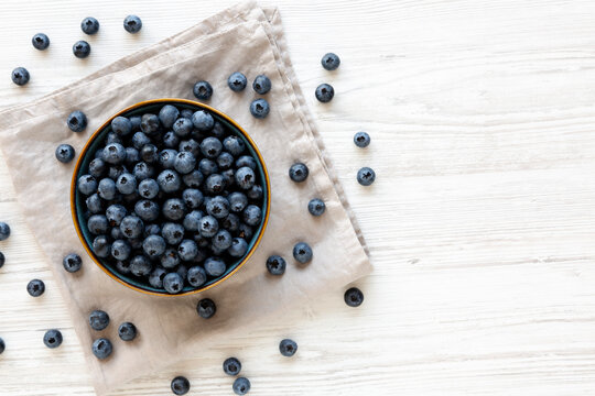 Healthy Organic Raw Blueberries in a Bowl, top view.  Copy space.