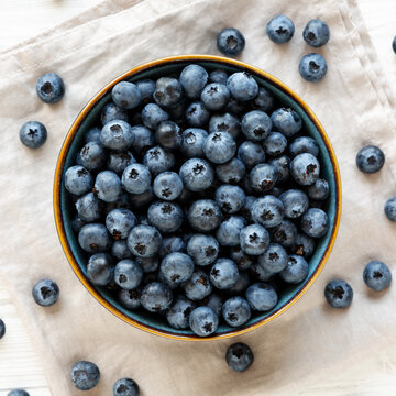 Healthy Organic Raw Blueberries in a Bowl, top view. Flat lay, overhead.