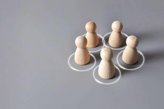 Social Connections and Community Concept with Wooden Figures in Circles