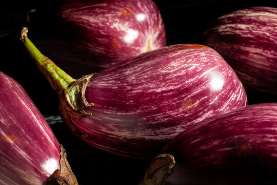 jewel marble eggplant on black wood background