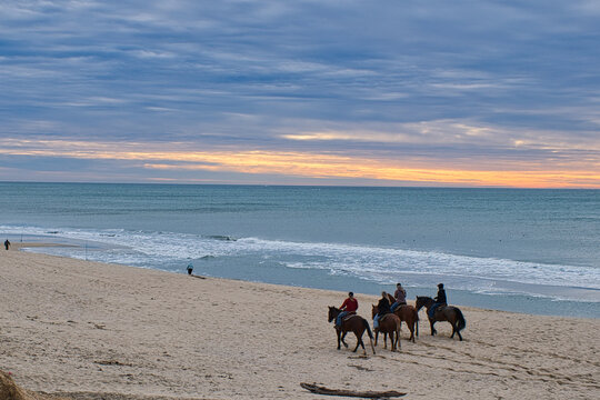 Horse riding in Half Moon Bay at Sunset