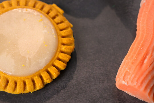 Selective focus on a cookie and a jamoncillo traditional Mexican sweets