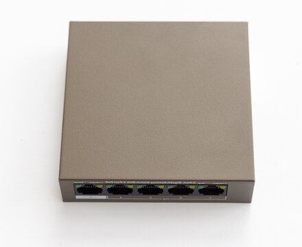 Grey network switch with multiple ethernet ports on white