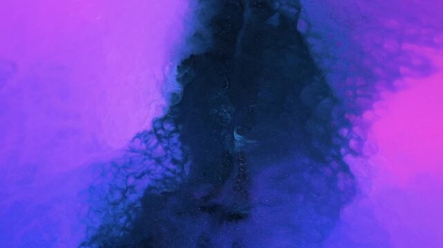 Close-up of mixing colored alcohol inks on a flat surface