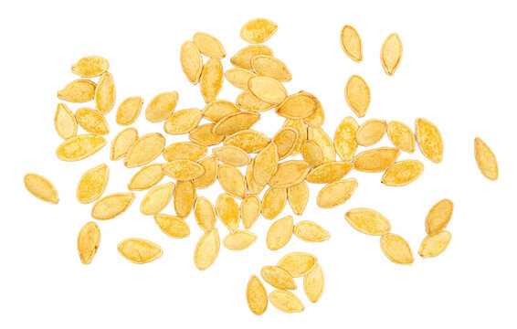 Pile roasted pumpkin seeds with salt isolated on white background, top view