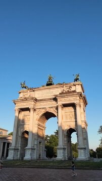 "Arco della Pace" (Peace Arch) of Milan, Italy at sunset during summer season - 4k footage.