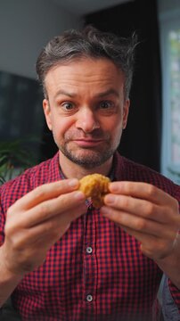 Junk food advertisement concept. Man eating fried chicken, enjoying fast food.