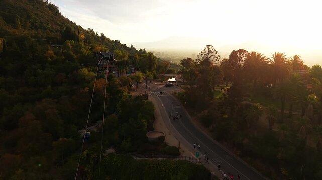 Drone Horizontal Forward Shot of the San Cristobal Cableway Station and Park at Sunset, Chile