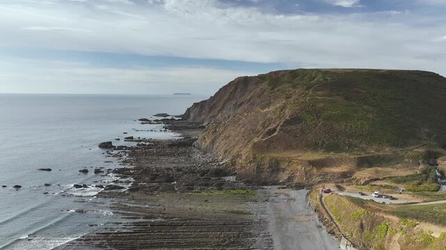 Cliffs and Farms over North Devon and Cornwall Coastpath Border from a drone, Welcombe Mouth Beach, Devon, Cornwall, England, Summer 2026