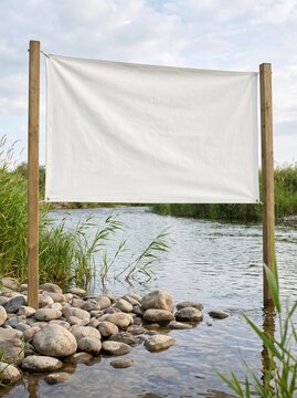 Blank White Banner Mockup Outdoors on a Scenic Riverbank