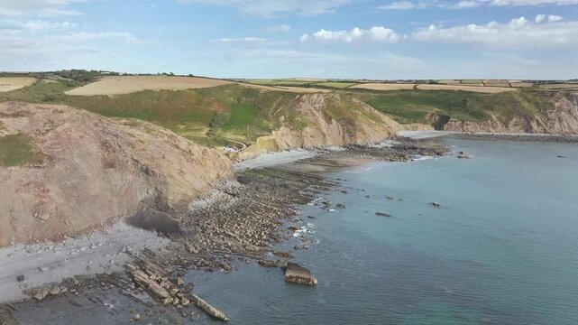 Cliffs and Farms over North Devon and Cornwall Coastpath Border from a drone, Welcombe Mouth Beach, Devon, Cornwall, England, Summer 2026