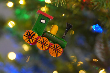 Close up of a Christmas Ornament of a Train Engine Hanging on a Christmas Tree © David Gales