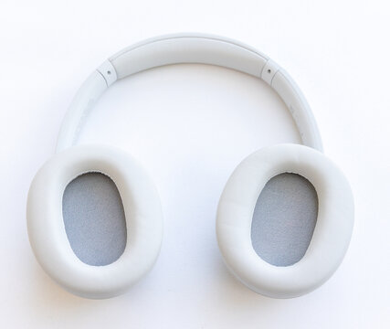 Modern white wireless headphones isolated on clean white background