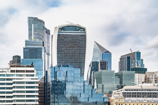 View of the modern skyline of the City of London featuring the 20 Fenchurch Street building, glass skyscrapers, and urban architecture in London, England, United Kingdom.