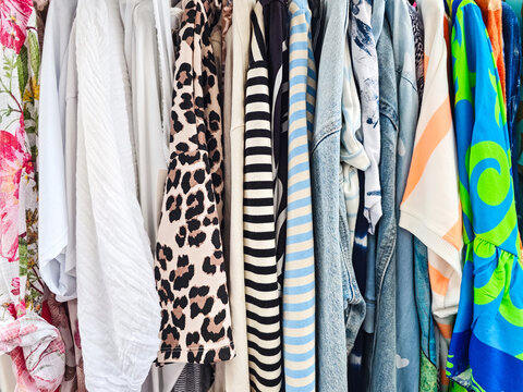 Clothing rack displaying diverse garments with various patterns