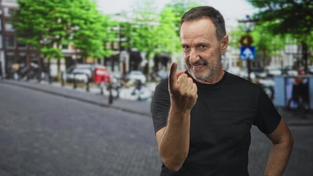Man beckons with finger toward camera on street, hand raised and wrist visible; invitation confidence.