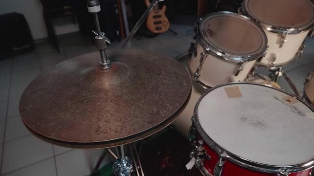 Close-up of acoustic drum set with cymbals and snare in music rehearsal studio