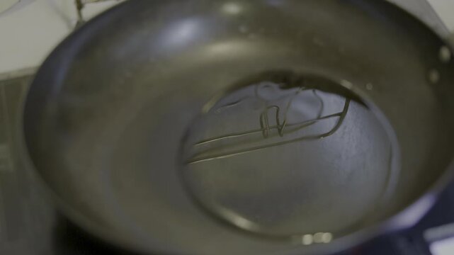 Adding Oil and Onions to an Iron Skillet for Caramelized Onions.