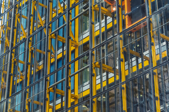 View of the yellow steel exoskeleton and glass facade of the Leadenhall Building in London, England, United Kingdom.