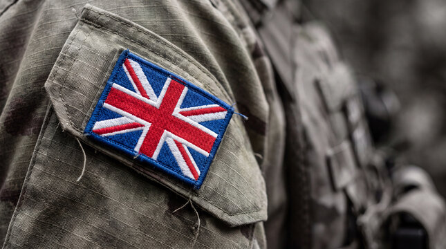 Close-up of a soldier's camouflage uniform sleeve featuring a patch of the Union Jack flag.
