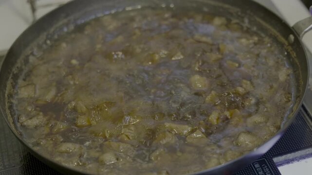 Lu Rou Fan（魯肉飯）Simmering in an Iron Skillet After Seasoning and Skimming.