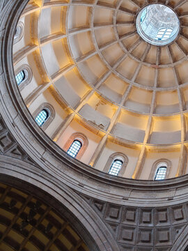 View of the ornate dome and arched windows inside the Catedral de Merida, showcasing historic colonial architecture with warm interior lighting in Merida, Yucatan, Mexico.