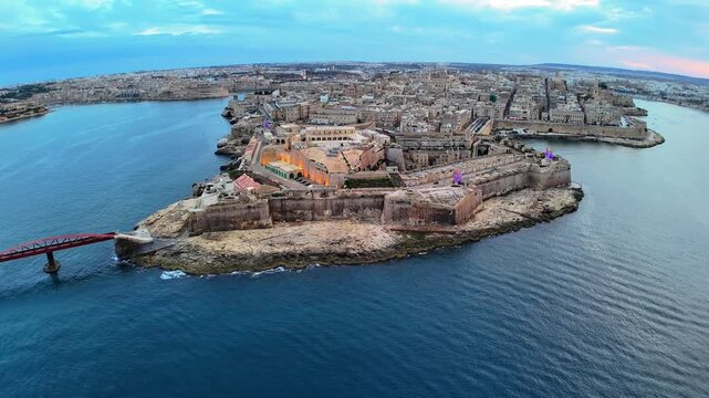 Aerial Drone View of Fort St Angelo Bastions and Iconic Red Bridge in Birgu Vittoriosa Malta