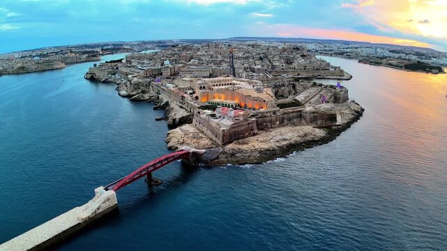 Aerial Drone View of Fort St Angelo Malta at Dramatic Golden Hour Sunset with Mediterranean Sea